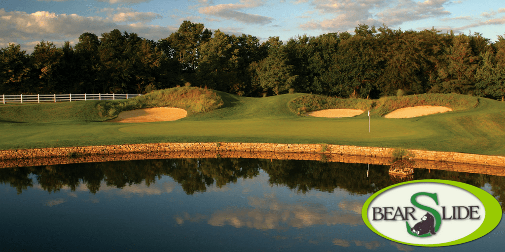 Bear Slide Scenic view of Bear Slide Golf Course, showcasing lush fairways, vibrant greens, and a clear blue sky.
